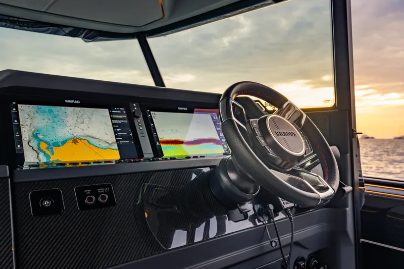 Slide: The Image of BRABUS 1000 yacht cockpit with advanced navigation displays, 2027 model, at sunset. - 32