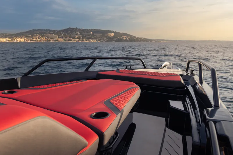 Slide: The Image of Luxury BRABUS 1000 boat with red seating, cruising on open water, 2027 model. - 16