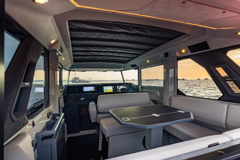 Slide: The Image of Luxurious interior of 2027 BRABUS 1000 yacht with modern seating and ocean view. - 29