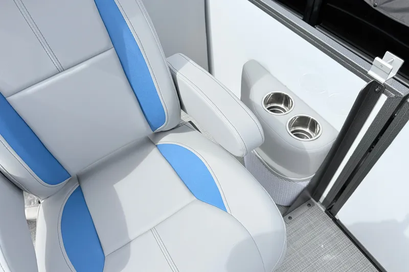 Slide: The Image of 2027 Bentley Pontoons Legacy 223 Navigator seat with blue accents and dual cup holders. - 9
