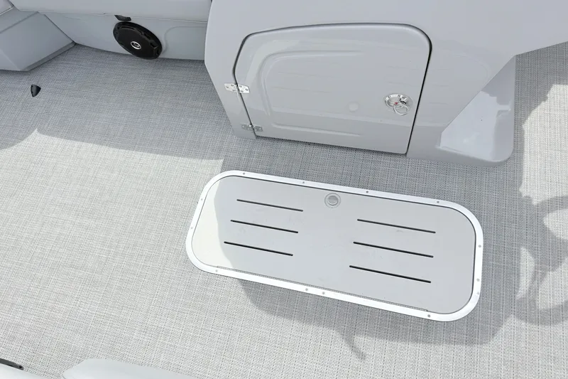 Slide: The Image of 2027 Bentley Pontoons Legacy 223 Navigator deck with storage compartment and speaker. - 5
