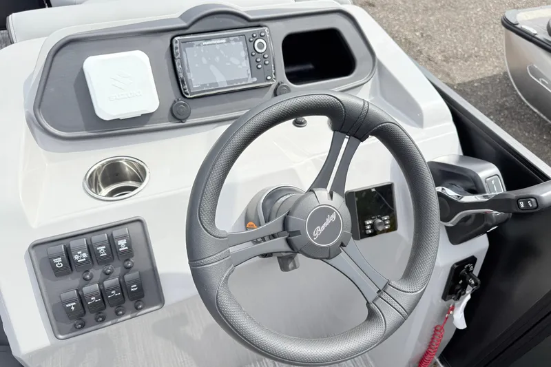Slide: The Image of Steering console of 2027 Bentley Pontoons Bolt 223 with controls and navigation display. - 10