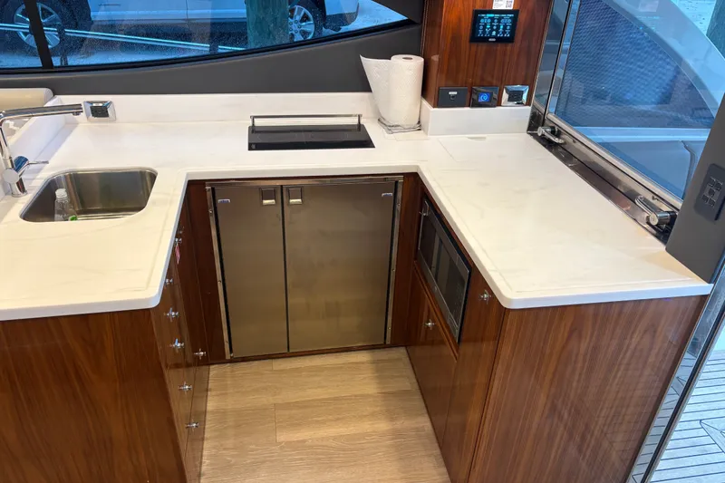 Slide: The Image of Luxurious kitchen interior of 2025 Riviera 46 Sports Motor Yacht with modern appliances. - 9