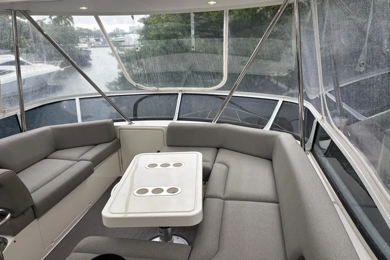 Slide: The Image of Luxurious interior of 2025 Riviera 46 Sports Motor Yacht with spacious seating and table. - 21