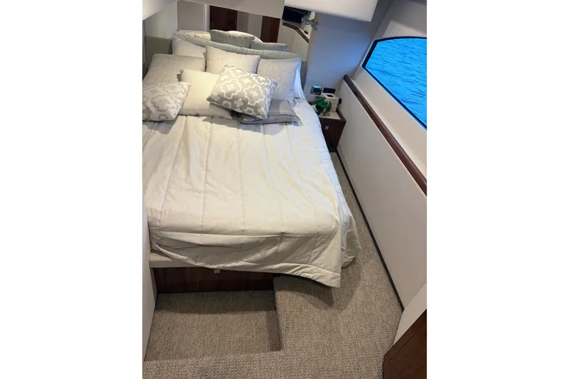 Slide: The Image of Luxurious bedroom interior of 2025 Riviera 46 Sports Motor Yacht with ocean view. - 14