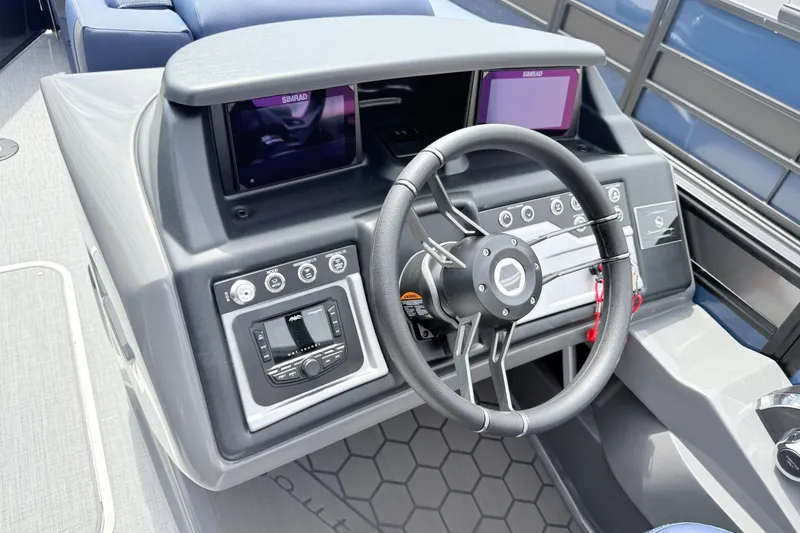 Slide: The Image of Steering console of 2026 South Bay 525UL DC boat with modern controls and displays. - 12