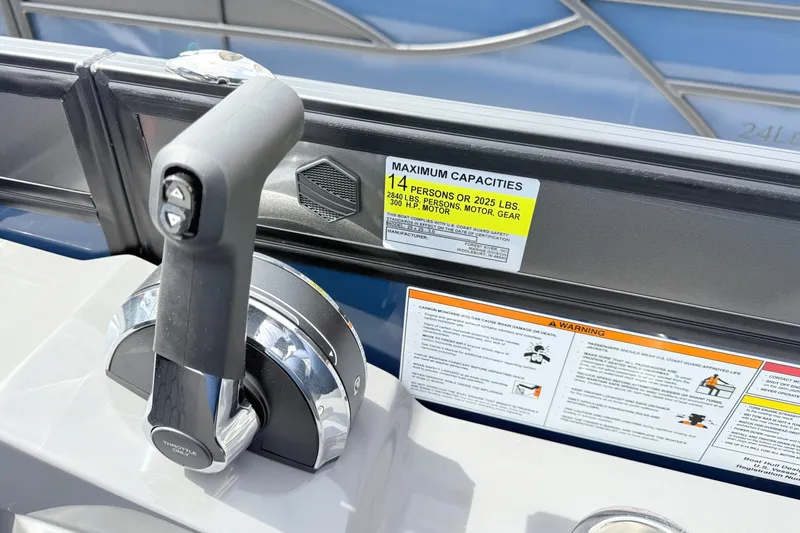 Slide: The Image of Throttle control and capacity warning on 2026 South Bay 525UL DC boat. - 13