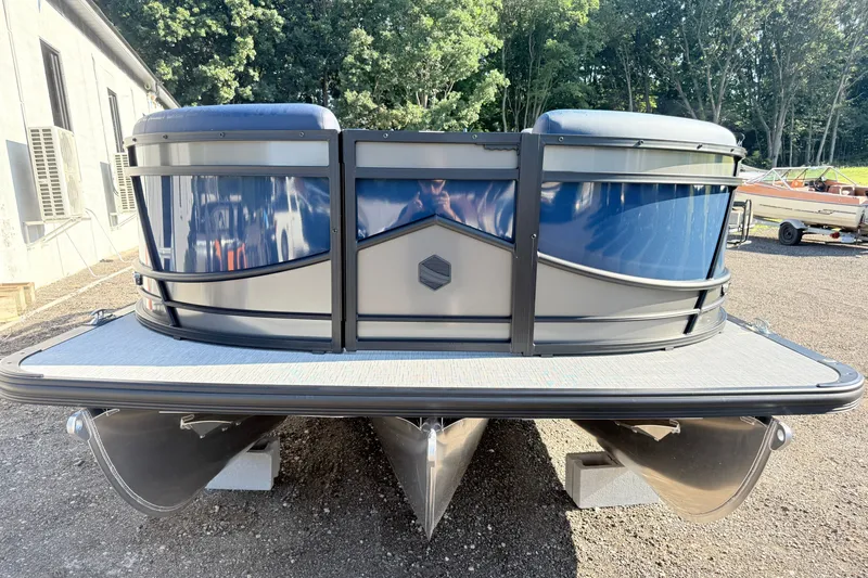 Slide: The Image of 2026 South Bay 525UL DC pontoon boat, front view, parked outdoors. - 3