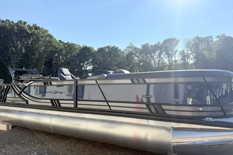 Slide: The Image of 2026 South Bay 525UL DC pontoon boat in a sunny outdoor setting. - 4
