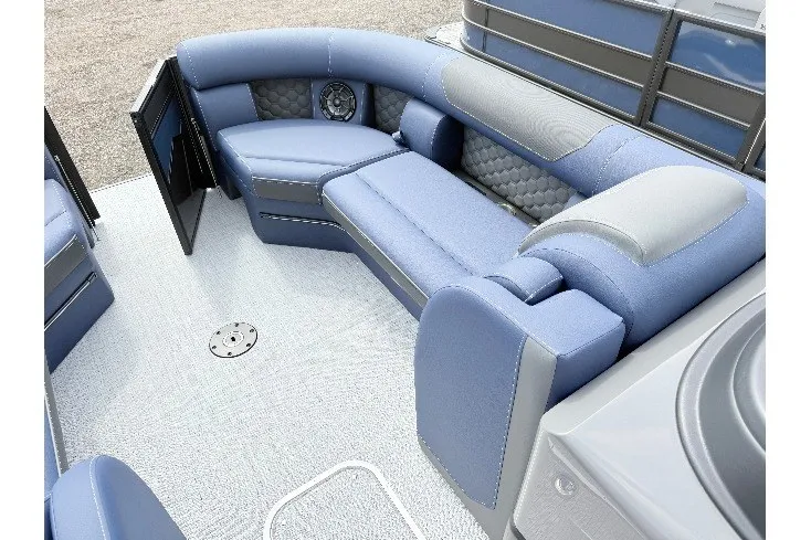 Slide: The Image of Luxurious interior of 2026 South Bay 525UL DC pontoon boat with blue seating. - 6