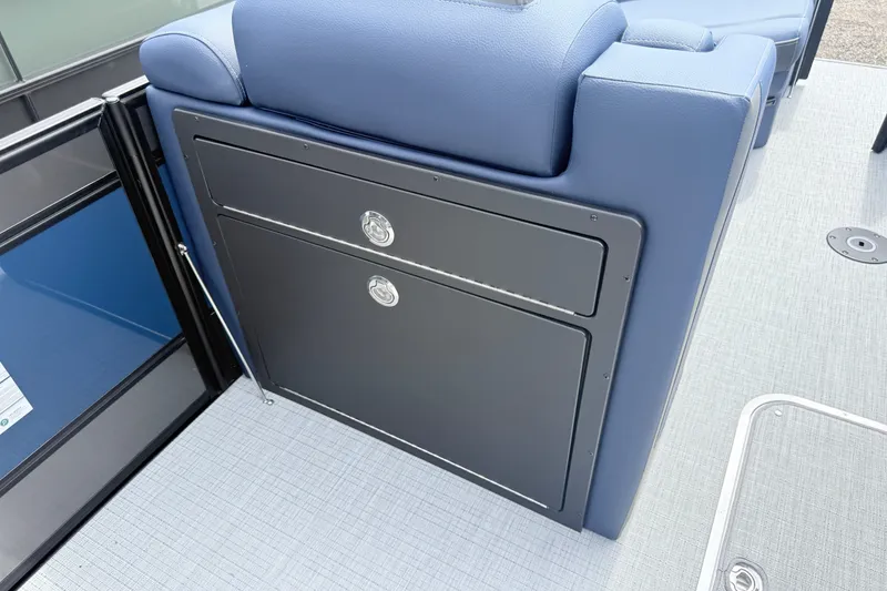 Slide: The Image of 2026 South Bay 525UL DC boat interior with blue seating and storage compartments. - 9