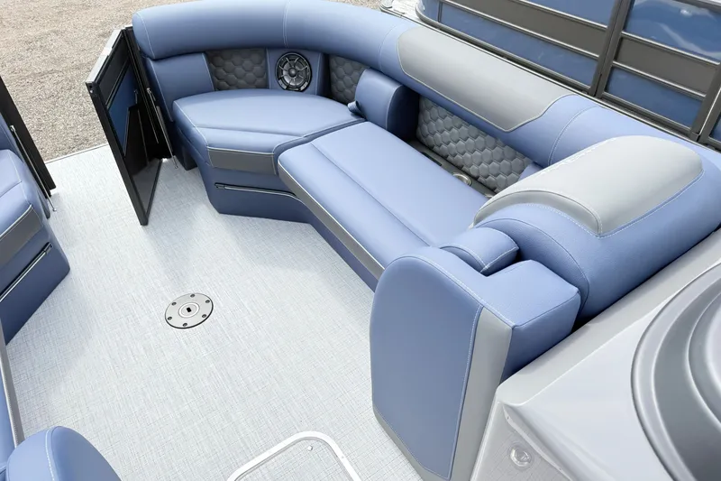 Slide: The Image of Luxurious seating area on 2026 South Bay 525UL DC boat with blue upholstery. - 7