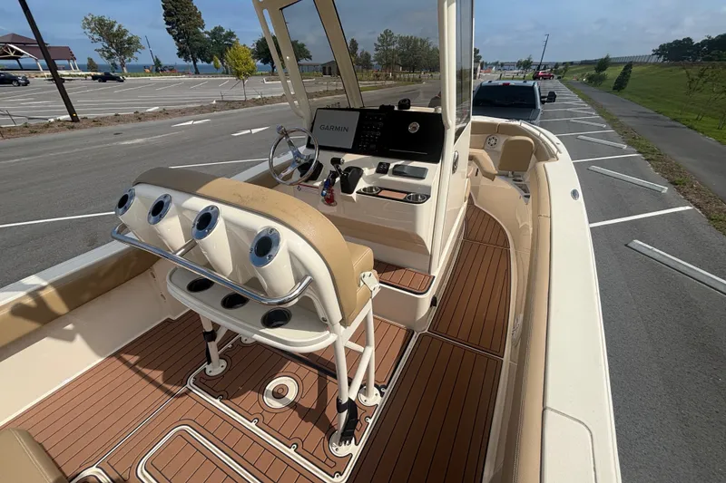 Slide: The Image of 2021 SCOUT 235 XSF HELM CONSOLE FROM STARBOARD CORNER WITH ROCKET LAUNCHERS, CUP HOLDERS, STAINLESS STEEL HAND RAILING - 17