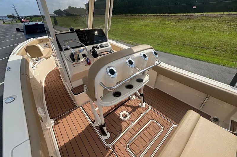 Slide: The Image of 2021 SCOUT 235 XSF HELM CONSOLE FROM PORT CORNER WITH ROCKET LAUNCHERS, CUP HOLDERS, STAINLESS STEEL HAND RAILING - 16