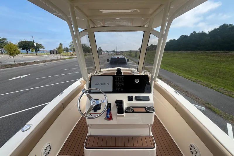 Slide: The Image of 2021 SCOUT 235 XSF HELM CONSOLE WITH HARDTOP, GLASS ENCLOSURE, SEADEK AND COMBING ALONG GUNWALES - 14