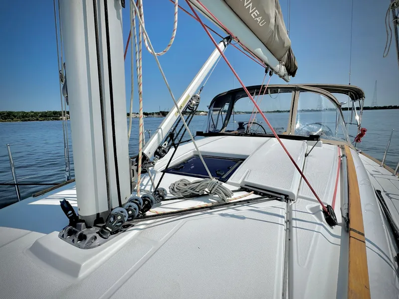Slide: The Image of 2015 Jeanneau Sun Odyssey 379 sailboat deck with rigging and clear sky. - 20