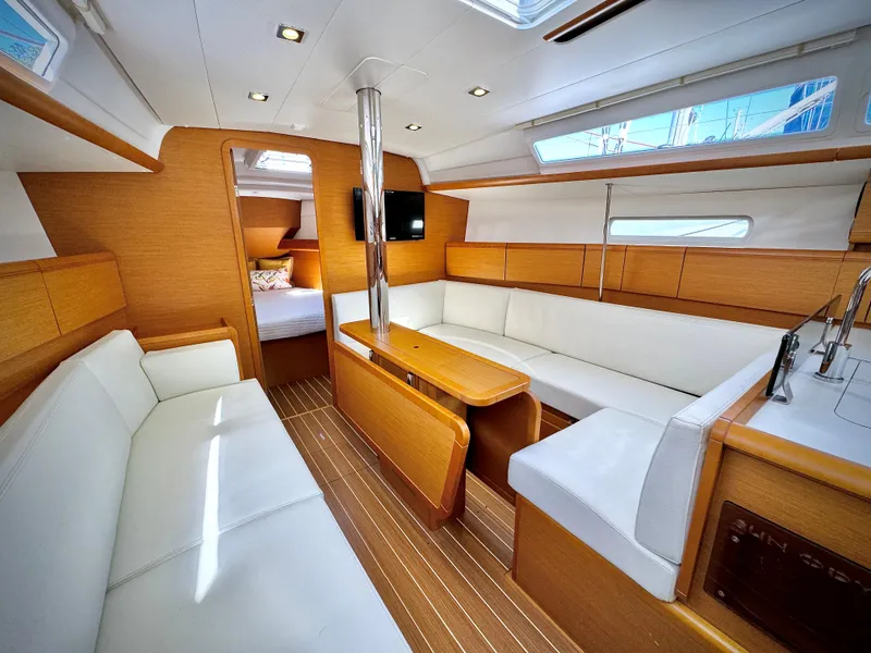 Slide: The Image of Interior of 2015 Jeanneau Sun Odyssey 379 yacht with modern seating and wood finish. - 32