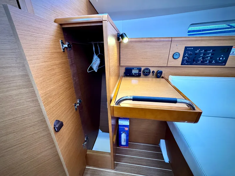 Slide: The Image of Interior of 2015 Jeanneau Sun Odyssey 379 sailboat with navigation panel and storage. - 40