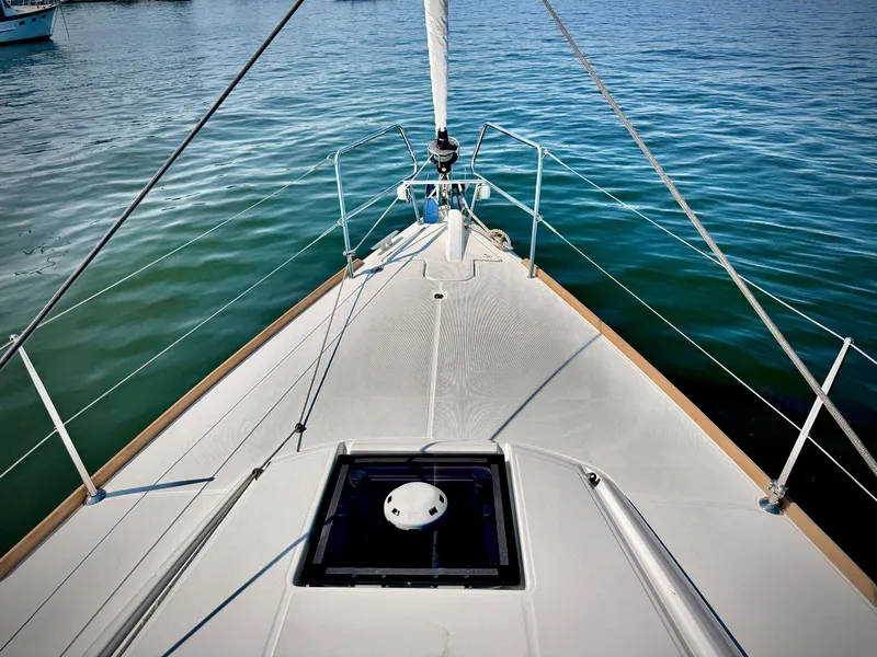 Slide: The Image of Bow view of 2015 Jeanneau Sun Odyssey 379 sailboat on calm water. - 15