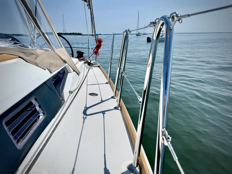 Slide: The Image of Jeanneau Sun Odyssey 379 sailboat deck, 2015 model, on calm waters. - 18