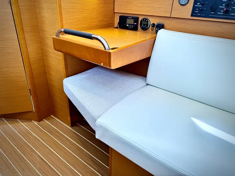 Slide: The Image of Interior of 2015 Jeanneau Sun Odyssey 379 yacht with seating and navigation station. - 41