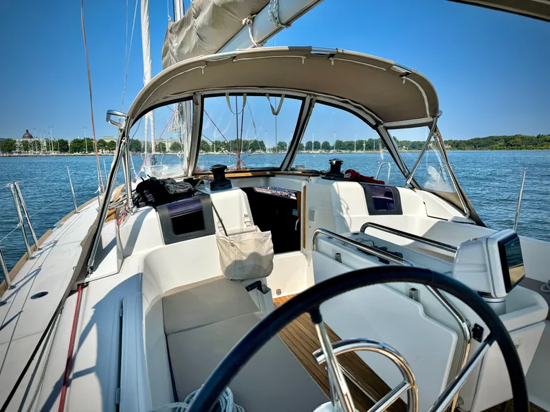 Slide: The Image of 2015 Jeanneau Sun Odyssey 379 sailboat cockpit on a sunny day. - 24