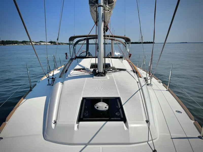 Slide: The Image of 2015 Jeanneau Sun Odyssey 379 sailboat deck on calm water. - 19