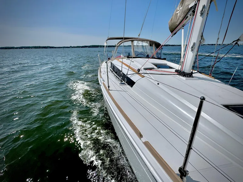 Slide: The Image of 2015 Jeanneau Sun Odyssey 379 sailing on open water. - 9