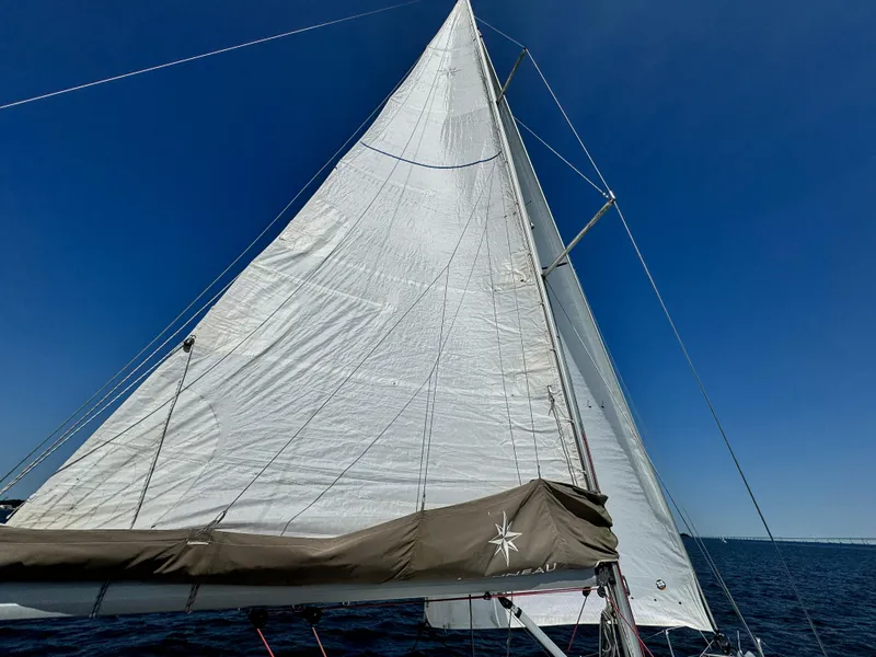 Slide: The Image of Jeanneau Sun Odyssey 379 sailboat, 2015 model, sailing under clear blue sky. - 13