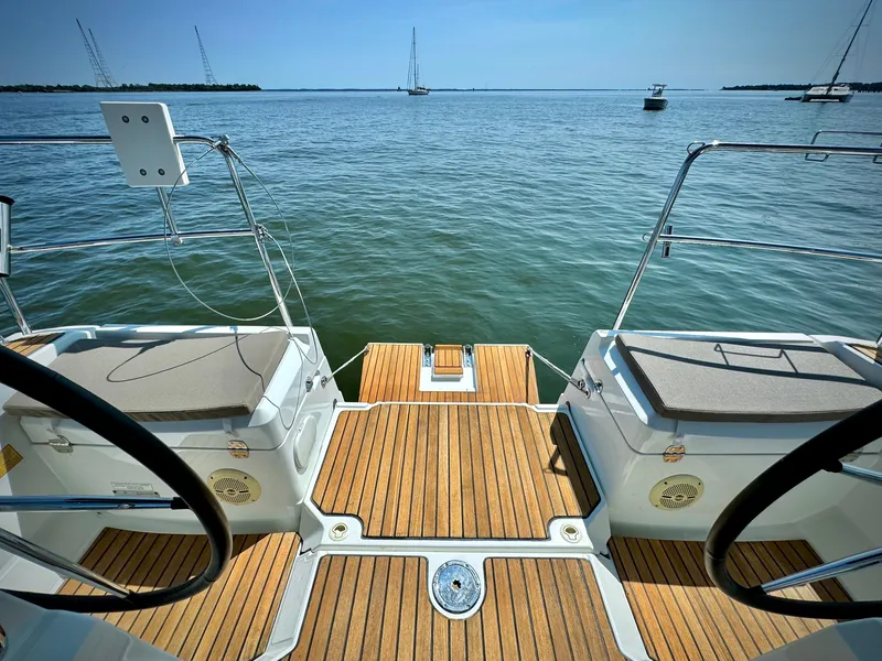 Slide: The Image of Jeanneau Sun Odyssey 379, 2015 model, teak deck, ocean view, sailboats in distance. - 5