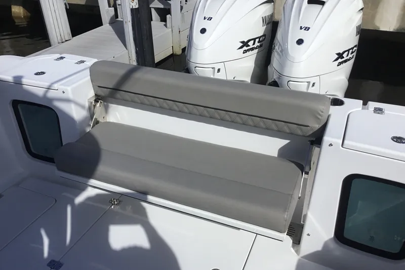 Slide: The Image of 2025 Sportsman Open 322 Center Console with dual Yamaha XTO engines and cushioned seating. - 50