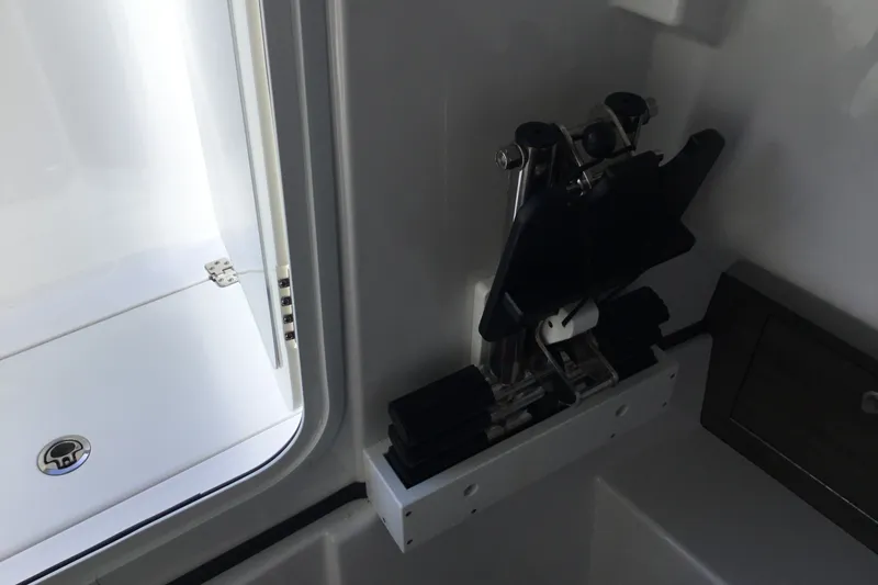 Slide: The Image of Interior view of 2025 Sportsman Open 322 Center Console boat, featuring a mounted accessory. - 30
