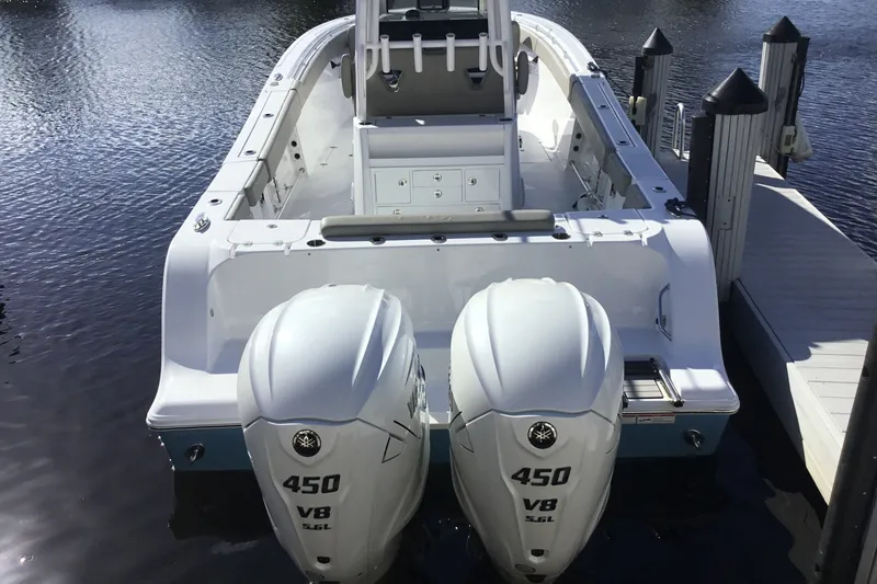 Slide: The Image of 2025 Sportsman Open 322 Center Console boat with twin 450 V8 engines docked. - 70