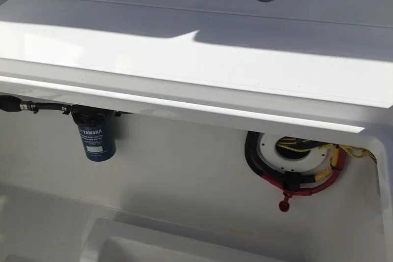 Slide: The Image of 2025 Sportsman Open 322 Center Console interior with Yamaha filter and wiring. - 54