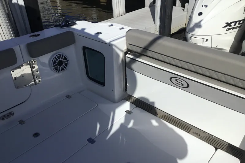 Slide: The Image of 2025 Sportsman Open 322 Center Console boat interior with seating and speaker. - 49