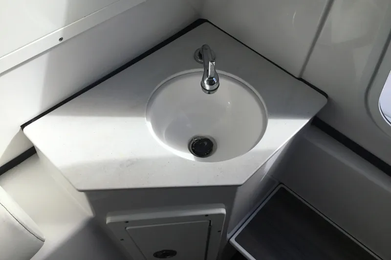 Slide: The Image of 2025 Sportsman Open 322 Center Console boat sink with modern faucet design. - 29