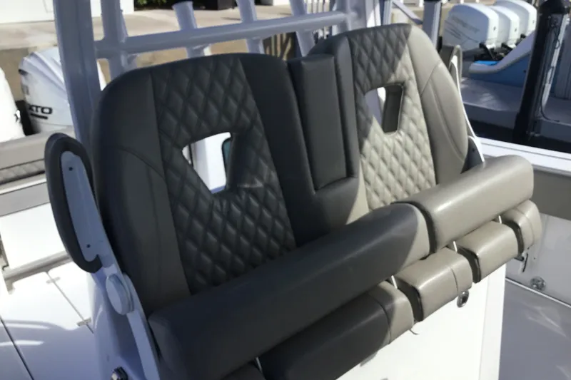 Slide: The Image of 2025 Sportsman Open 322 Center Console boat seats with diamond stitching. - 44