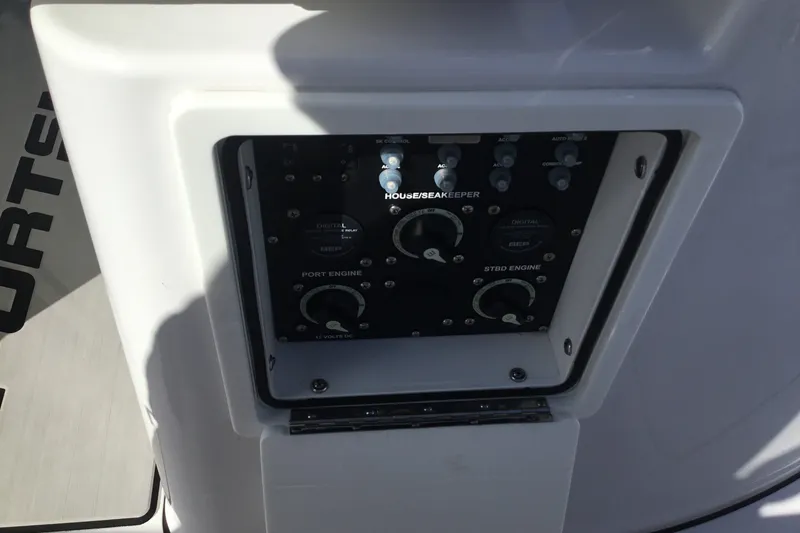 Slide: The Image of Control panel of 2025 Sportsman Open 322 Center Console boat, featuring engine and system controls. - 66