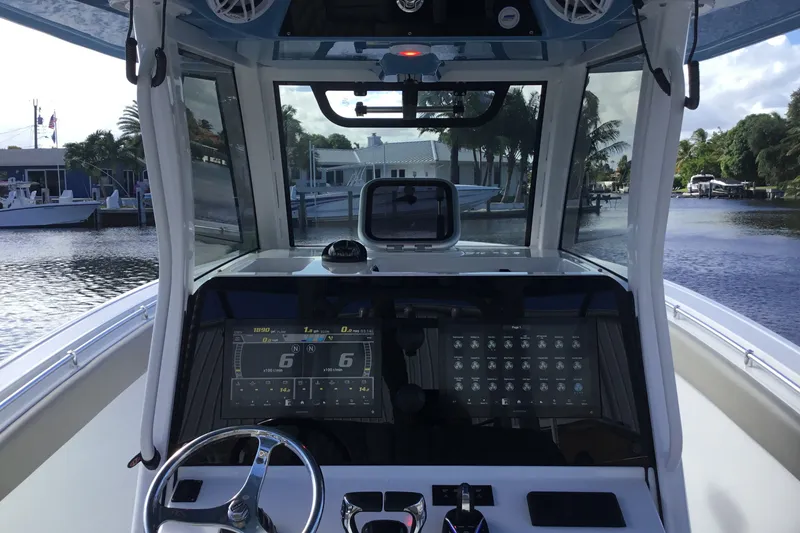 Slide: The Image of 2025 Sportsman Open 322 Center Console boat dashboard with advanced navigation system. - 35