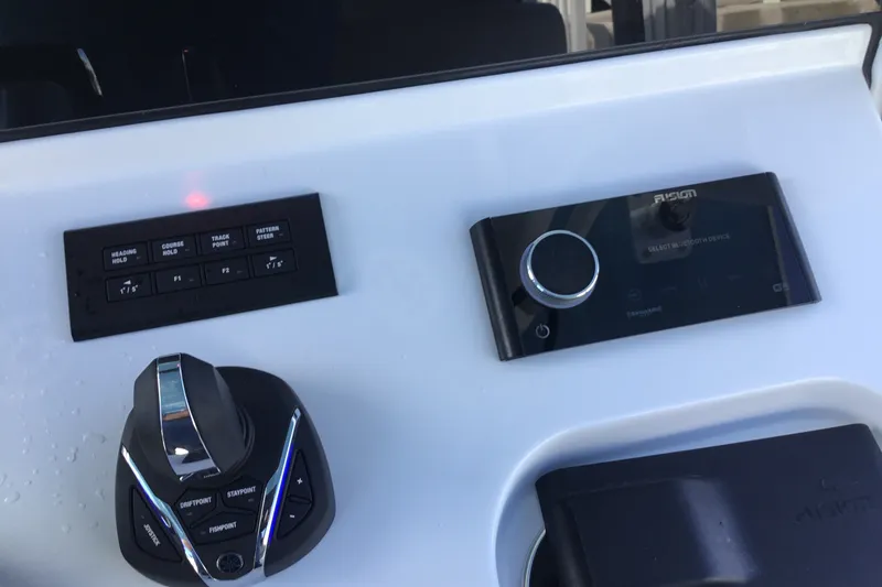Slide: The Image of Control panel of 2025 Sportsman Open 322 Center Console boat with joystick and display. - 41
