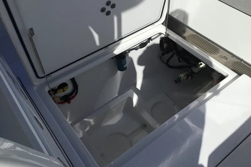 Slide: The Image of Open storage compartment of 2025 Sportsman Open 322 Center Console boat. - 51