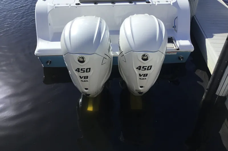 Slide: The Image of 2025 Sportsman Open 322 Center Console with twin 450 V8 engines docked. - 69