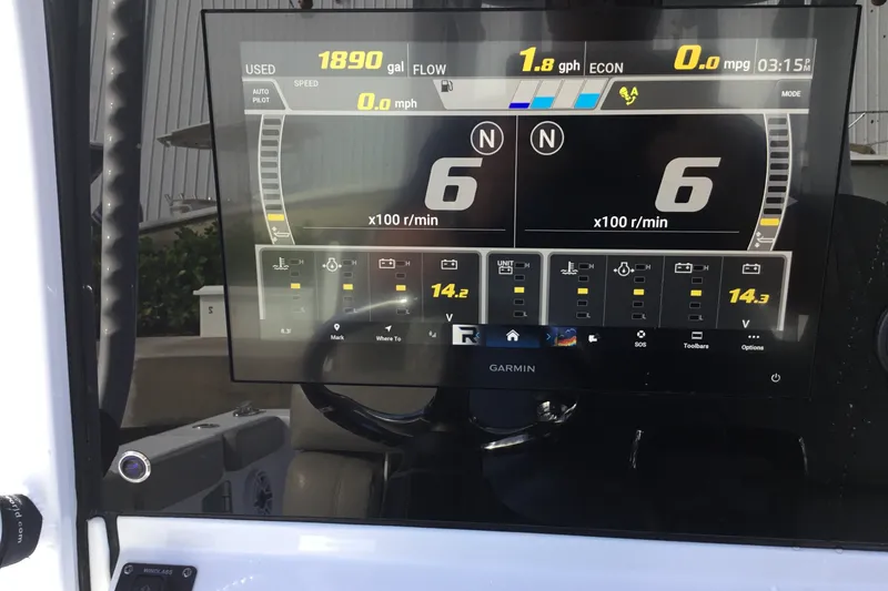 Slide: The Image of Dashboard of a 2025 Sportsman Open 322 Center Console boat with Garmin display. - 39