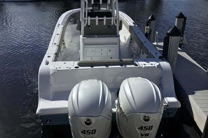 Slide: The Image of 2025 Sportsman Open 322 Center Console boat with twin 450 V8 engines docked. - 71