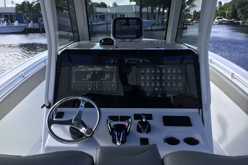 Slide: The Image of 2025 Sportsman Open 322 Center Console dashboard with modern controls and dual displays. - 37