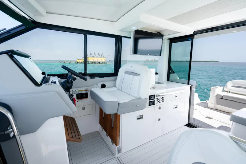 Slide: The Image of Interior of 2022 Regal 36 Grande Coupe yacht with ocean view. - 31
