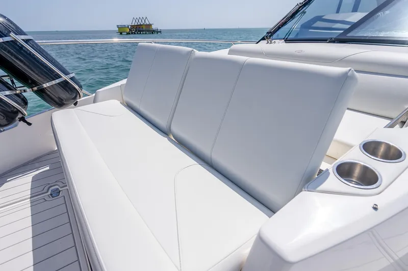 Slide: The Image of Luxurious seating on 2022 Regal 36 Grande Coupe yacht with ocean view. - 18