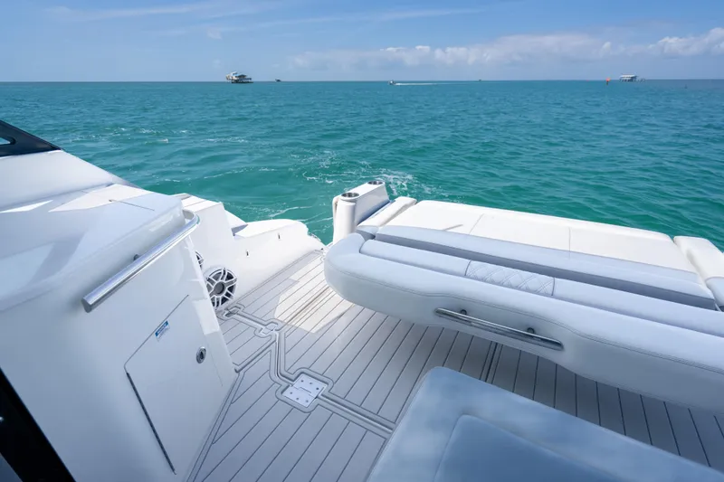 Slide: The Image of Luxury deck view of 2022 Regal 36 Grande Coupe on open sea. - 61