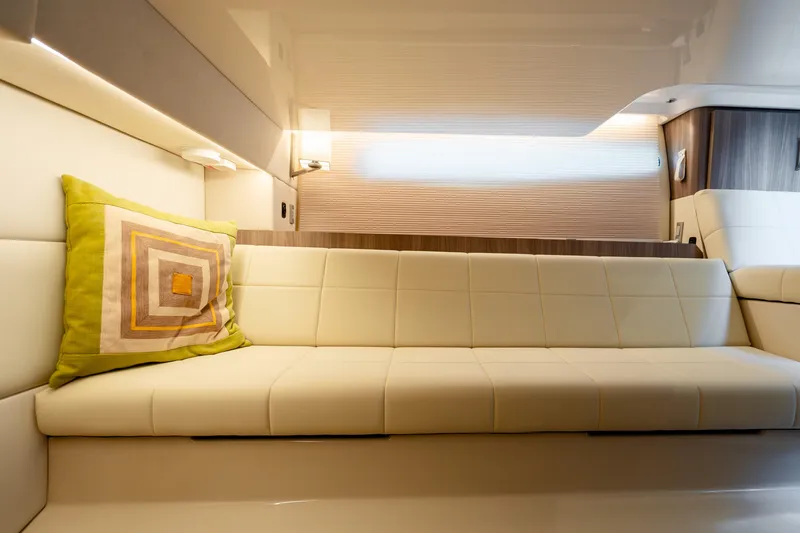 Slide: The Image of Luxurious interior of 2022 Regal 36 Grande Coupe with beige seating and decorative pillow. - 44