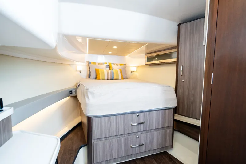 Slide: The Image of Luxurious cabin interior of 2022 Regal 36 Grande Coupe yacht with modern furnishings. - 39
